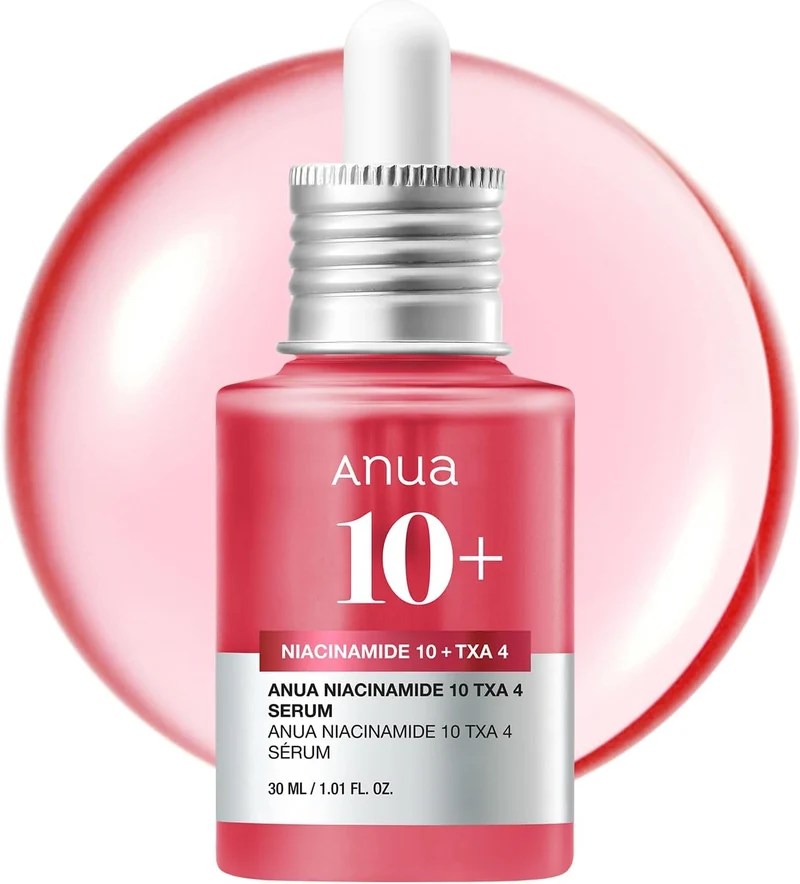 A bottle of Anua Niacinamide 10 TXA 4 serum with a dropper, featuring a pink label and a soft pink background.